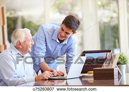 Teenage Grandson Helping Grandfather With Laptop View Large Photo Image Stock Photo - Teenage Grandson Helping Grandfather With Laptop. Fotosearch