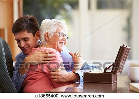 Teenage Grandson Hugging Grandmother View Large Photo Image Stock Image - Teenage Grandson Hugging Grandmother. Fotosearch