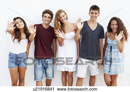 Teenage Group Leaning Against Wall Waving View Large Photo Image Stock Image - Teenage Group Leaning Against Wall Waving. Fotosearch