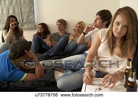 Teenagers drinking and smoking View Large Photo Image Stock Photograph - Teenagers drinking and smoking. Fotosearch
