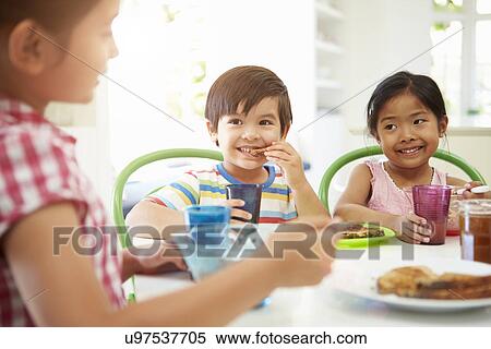 Three Asian Children Having Breakfast Together In Kitchen View Large Photo Image Stock Photography - Three Asian Children Having Breakfast Together In Kitchen. Fotosearch