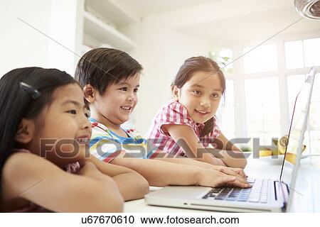 Three Asian Children Using Laptop At Home View Large Photo Image Stock Image - Three Asian Children Using Laptop At Home. Fotosearch