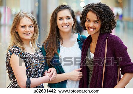 Three Female Friends Shopping In Mall Together View Large Photo Image Stock Image - Three Female Friends Shopping In Mall Together. Fotosearch