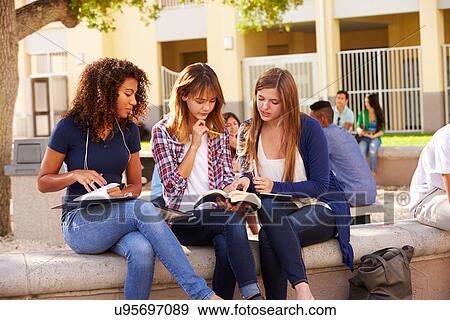 Stock Photo - Three Female High School Students Working On Campus . Fotosearch