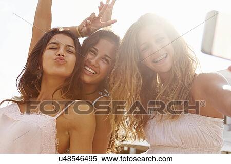 Three Teenage Girls Dancing And Taking Selfie View Large Photo Image Stock Photography - Three Teenage Girls Dancing And Taking Selfie . Fotosearch
