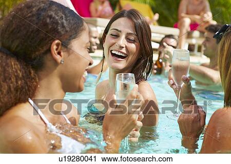 Three Women Having Party In Swimming Pool Drinking Champagne View Large Photo Image Stock Image - Three Women Having Party In Swimming Pool Drinking Champagne. Fotosearch