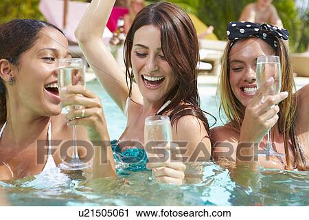 Three Women Having Party In Swimming Pool Drinking Champagne View Large Photo Image Stock Image - Three Women Having Party In Swimming Pool Drinking Champagne. Fotosearch