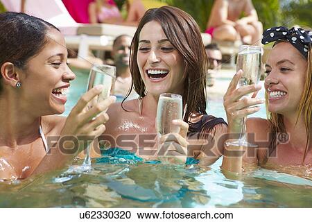 Three Women Having Party In Swimming Pool Drinking Champagne View Large Photo Image Stock Image - Three Women Having Party In Swimming Pool Drinking Champagne. Fotosearch