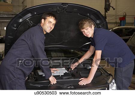 Trainee mechanic at work View Large Photo Image Stock Image - Trainee mechanic at work. Fotosearch