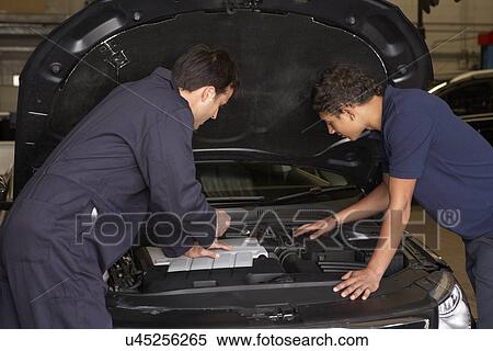 Trainee mechanic at work View Large Photo Image Stock Photography - Trainee mechanic at work. Fotosearch