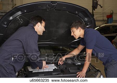 Trainee mechanic at work View Large Photo Image Stock Photography - Trainee mechanic at work. Fotosearch