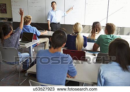 Tutor With High School Students In Class Using Laptops View Large Photo Image Stock Image - Tutor With High School Students In Class Using Laptops. Fotosearch