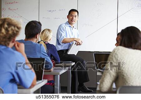 Tutor With High School Students In Class Using Laptops View Large Photo Image Stock Photograph - Tutor With High School Students In Class Using Laptops. Fotosearch