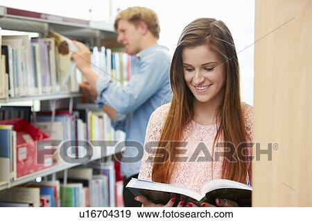 Stock Photo - Two College Students Studying In Library. Fotosearch
