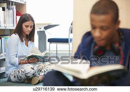 Two College Students Studying In Library View Large Photo Image Stock Photo - Two College Students Studying In Library. Fotosearch