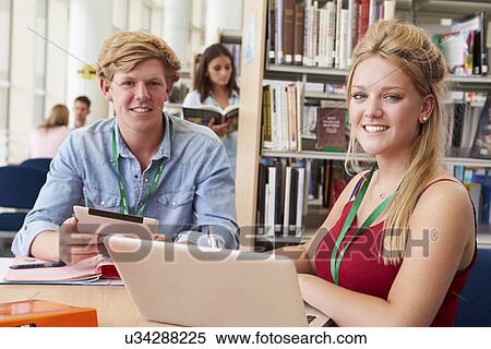 Two College Students Studying In Library Together View Large Photo Image Stock Photography - Two College Students Studying In Library Together. Fotosearch