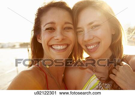 Two Female Friends On Summer Holiday Together View Large Photo Image Stock Image - Two Female Friends On Summer Holiday Together . Fotosearch