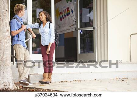 Picture - Two High School Students Standing Outside Building. Fotosearch
