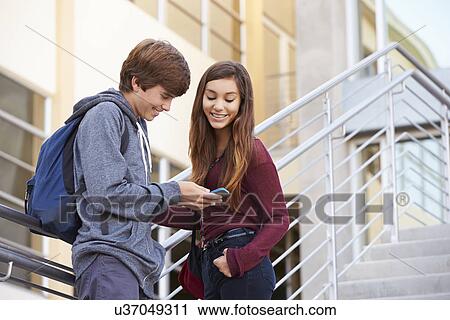 Two High School Students Standing Outside Building View Large Photo Image Stock Image - Two High School Students Standing Outside Building. Fotosearch