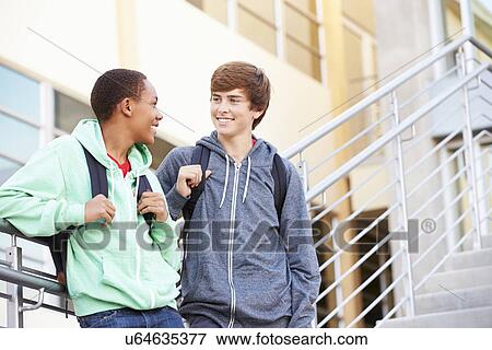 Two Male High School Students Standing Outside Building View Large Photo Image Stock Photo - Two Male High School Students Standing Outside Building. Fotosearch