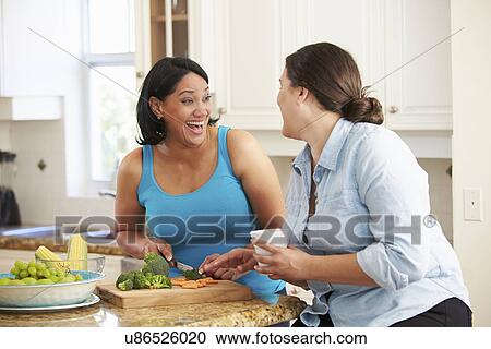 Two Overweight Women On Diet Preparing Vegetables in Kitchen View Large Photo Image Stock Image - Two Overweight Women On Diet Preparing Vegetables in Kitchen. Fotosearch