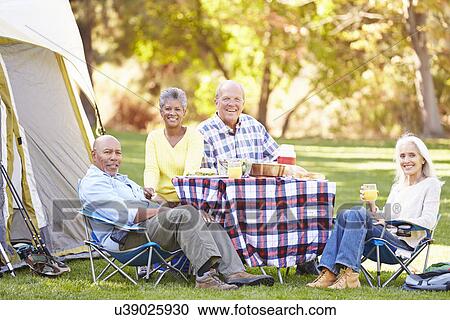 Two Senior Couples Enjoying Camping Holiday In Countryside View Large Photo Image Stock Image - Two Senior Couples Enjoying Camping Holiday In Countryside. Fotosearch