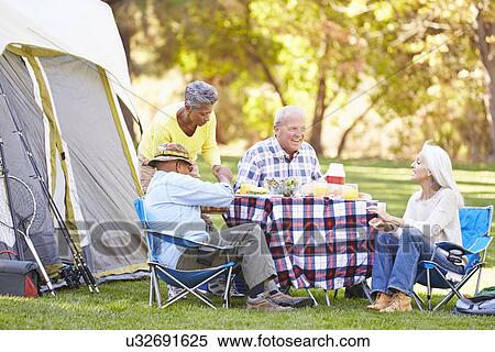 Two Senior Couples Enjoying Camping Holiday In Countryside View Large Photo Image Stock Photography - Two Senior Couples Enjoying Camping Holiday In Countryside. Fotosearch