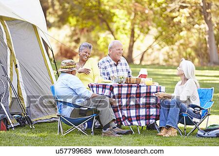 Two Senior Couples Enjoying Camping Holiday In Countryside View Large Photo Image Stock Photography - Two Senior Couples Enjoying Camping Holiday In Countryside. Fotosearch