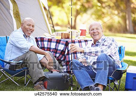 Two Senior Men On Camping Holiday With Fishing Rod View Large Photo Image Stock Image - Two Senior Men On Camping Holiday With Fishing Rod. Fotosearch