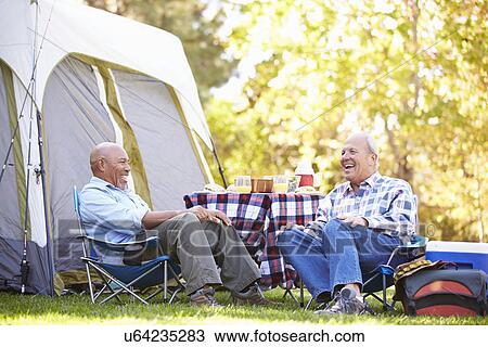 Two Senior Men Relaxing On Camping Holiday View Large Photo Image Stock Image - Two Senior Men Relaxing On Camping Holiday. Fotosearch