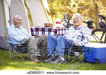 Two Senior Men Relaxing On Camping Holiday View Large Photo Image Stock Image - Two Senior Men Relaxing On Camping Holiday. Fotosearch