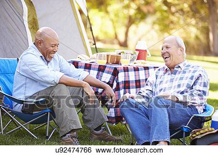 Two Senior Men Relaxing On Camping Holiday View Large Photo Image Stock Photograph - Two Senior Men Relaxing On Camping Holiday. Fotosearch