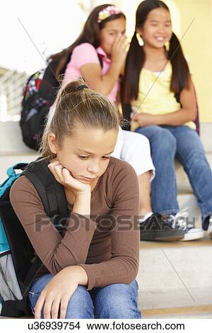 Picture - Unhappy Pre teen girl in school. Fotosearch