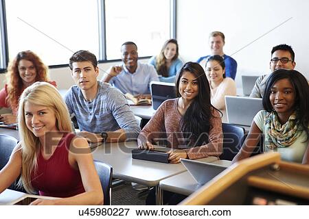 Stock Photo - University Students Using Digital Tablet And Laptop In Class. Fotosearch
