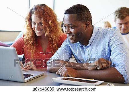 University Students Using Digital Tablet And Laptop In Class View Large Photo Image Stock Photo - University Students Using Digital Tablet And Laptop In Class. Fotosearch
