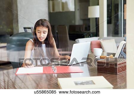 View Of Teenage Girl Using Laptop Through Window View Large Photo Image Stock Photography - View Of Teenage Girl Using Laptop Through Window. Fotosearch