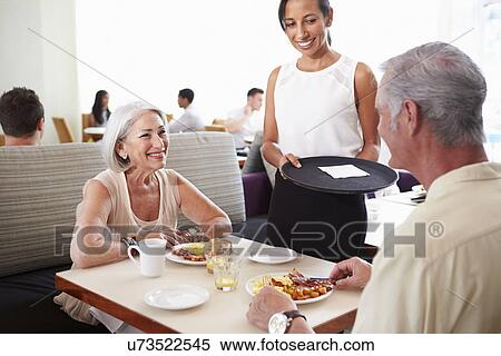 Waitress Serving Senior Couple Breakfast In Hotel Restaurant View Large Photo Image Stock Photography - Waitress Serving Senior Couple Breakfast In Hotel Restaurant. Fotosearch