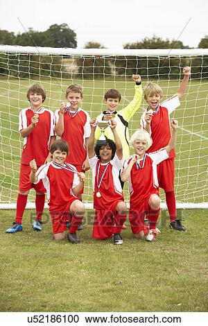 Winning junior football team portrait View Large Photo Image Stock Image - Winning junior football team portrait. Fotosearch