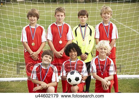Winning junior soccer team portrait View Large Photo Image Stock Photo - Winning junior soccer team portrait. Fotosearch