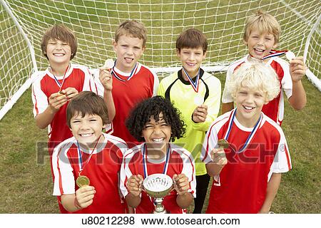 Winning junior soccer team portrait View Large Photo Image Stock Photo - Winning junior soccer team portrait. Fotosearch
