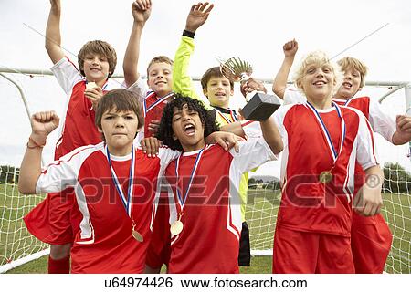 Stock Photograph - Winning junior soccer team portrait. Fotosearch