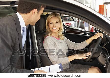 Woman buying new car View Large Photo Image Stock Photo - Woman buying new car. Fotosearch