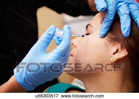 Woman Having Botox Treatment At Beauty Clinic View Large Photo Image Stock Photo - Woman Having Botox Treatment At Beauty Clinic. Fotosearch