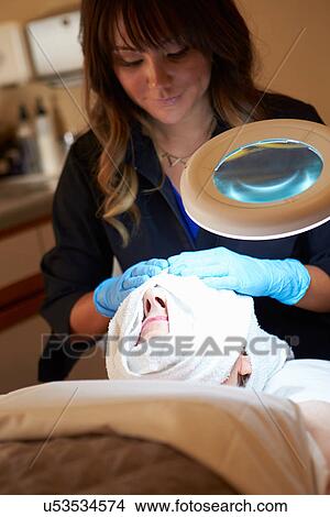 Picture - Woman Having Dermo Abrasion Cosmetic Treatment At Spa. Fotosearch