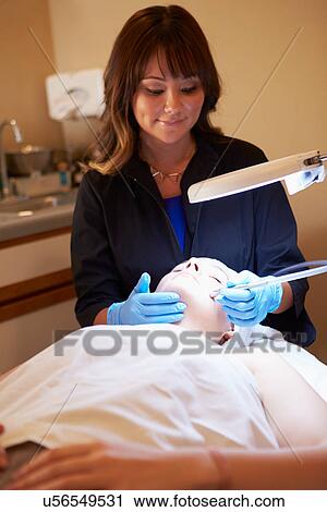Stock Image - Woman Having Dermo Abrasion Cosmetic Treatment At Spa. Fotosearch