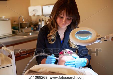 Stock Photo - Woman Having Dermo Abrasion Cosmetic Treatment At Spa. Fotosearch