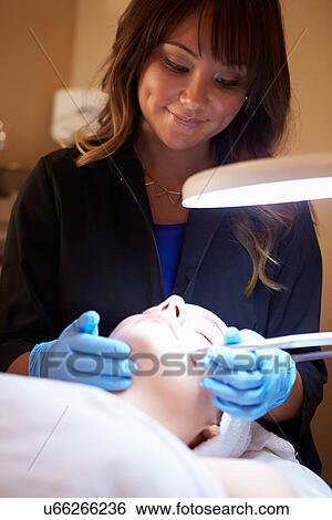 Stock Photograph - Woman Having Dermo Abrasion Cosmetic Treatment At Spa. Fotosearch