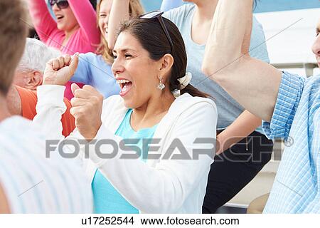 Woman In Crowd Celebrating At Sports Event View Large Photo Image Picture - Woman In Crowd Celebrating At Sports Event. Fotosearch
