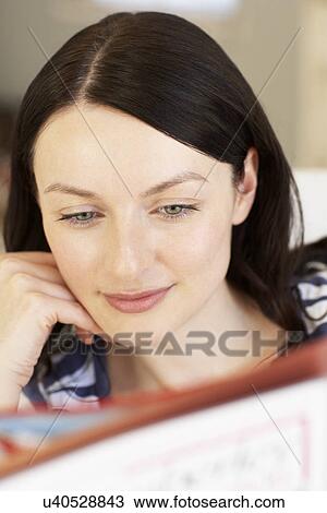 Stock Image - Woman reading. Fotosearch