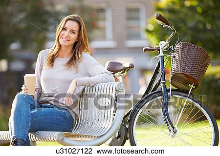 Woman Relaxing On Park Bench With Takeaway Coffee View Large Photo Image Stock Image - Woman Relaxing On Park Bench With Takeaway Coffee. Fotosearch